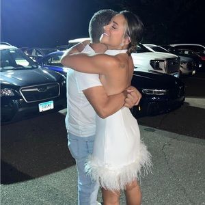 White dress with feathers